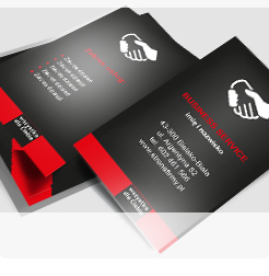 wizytówka biznesowa zaprojektowana w czerni z białymi napisami, uściskiem dłoni i czerwonymi elementami